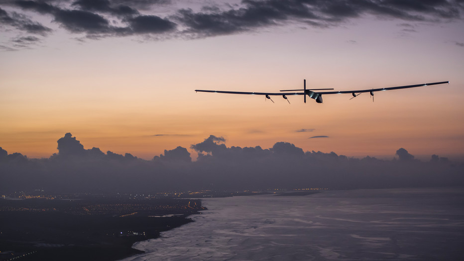 Hawaii, United States of America, July 3rd, 2015: Solar Impusle 2 lands in Hawaii with AndrÈ Borschberg at the controls. The First Round-the-World Solar Flight will take 500 flight hours and cover 35í000 km, over five months. Swiss founders and pilots, Bertrand Piccard and AndrÈ Borschberg hope to demonstrate how pioneering spirit, innovation and clean technologies can change the world. The duo will take turns flying Solar Impulse 2, changing at each stop and will fly over the Arabian Sea, to India, to Myanmar, to China, across the Pacific Ocean, to the United States, over the Atlantic Ocean to Southern Europe or Northern Africa before finishing the journey by returning to the initial departure point. Landings will be made every few days to switch pilots and organize public events for governments, schools and universities.